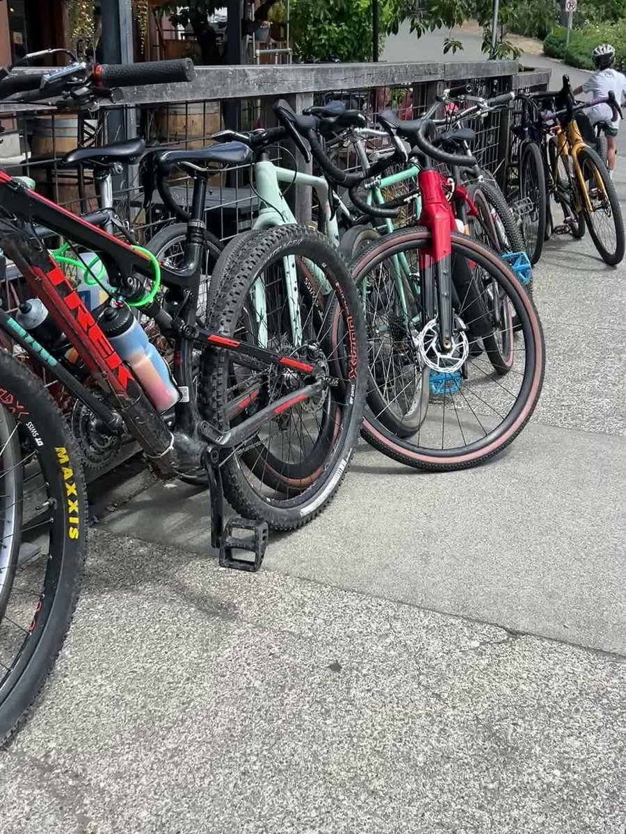 A rack of bikes locked up on the patio